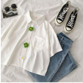 Camisa blusa informal con botones de margaritas